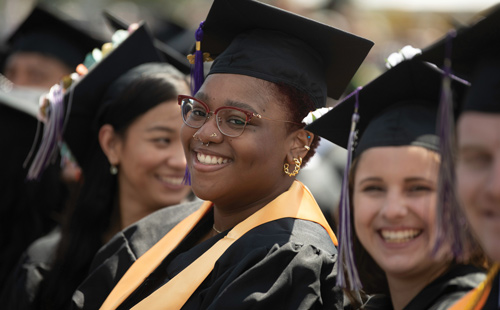 A smiling student at commencement