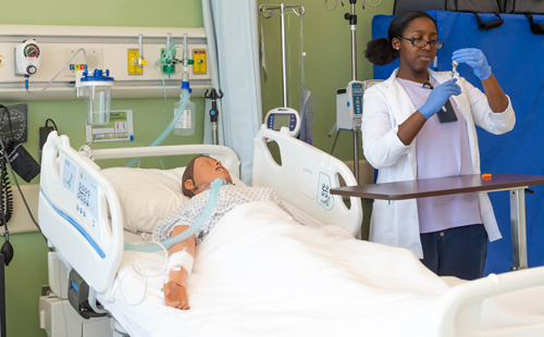 image of nurse with arms crossed and stethoscope around neck