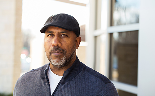 Man with a beard wearing a cap